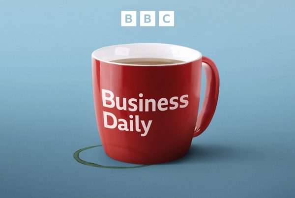 Blue background with a red coffee mug. On the mug is written BBC Business Daily. the BBC logo is on the top of the image.