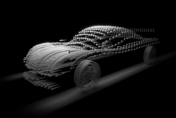 Aerodynamics. Silver coloured car with wind tunnels represented in dots across car structure.